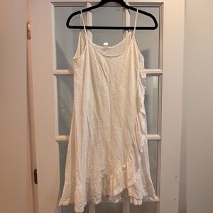 Goldie white mini dress 100% cotton with asymmetrical ruffle detailing size M